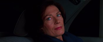 Movie still from “Mission: Impossible” (1996), directed by Brian De Palma – A person sitting in a car; Close Up shot, High angle