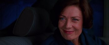 Movie still from “Mission: Impossible” (1996), directed by Brian De Palma – A woman with blue eyes looking at the camera; Close Up shot, Low angle