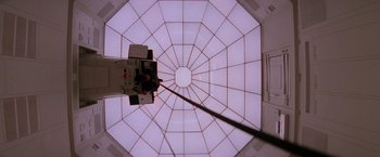 Movie still from “Mission: Impossible” (1996), directed by Brian De Palma – Looking up at the ceiling of a building; Wide shot, Low angle