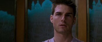Movie still from “Mission: Impossible” (1996), directed by Brian De Palma – A man's face in front of a dark background; Close Up shot, Low angle