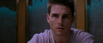 Movie still from “Mission: Impossible” (1996), directed by Brian De Palma – A man's face in front of a wall; Close Up shot, Low angle