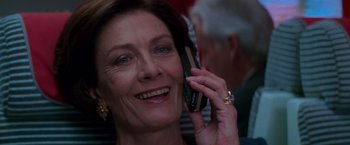 Movie still from “Mission: Impossible” (1996), directed by Brian De Palma – An older woman talking on a cell phone; Close Up shot, Low angle