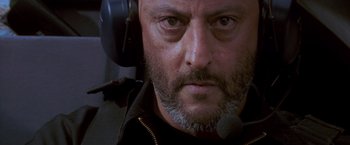 Movie still from “Mission: Impossible” (1996), directed by Brian De Palma – A person wearing a headset; Close Up shot, Low angle
