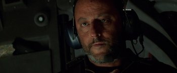 Movie still from “Mission: Impossible” (1996), directed by Brian De Palma – A person wearing a headset; Close Up shot, Low angle