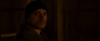 Movie still from “Mission: Impossible - Dead Reckoning Part One” (2023), directed by Christopher McQuarrie – A person wearing a hat; Close Up shot, Over the shoulder angle