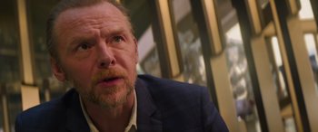 Movie still from “Mission: Impossible - Dead Reckoning Part One” (2023), directed by Christopher McQuarrie – A person wearing a suit and tie; Close Up shot, Over the shoulder angle