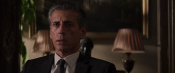 Movie still from “Mission: Impossible - Dead Reckoning Part One” (2023), directed by Christopher McQuarrie – A person wearing a suit and tie; Close Up shot, Over the shoulder angle