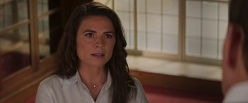 Movie still from “Mission: Impossible - Dead Reckoning Part One” (2023), directed by Christopher McQuarrie – A person wearing a white shirt; Close Up shot, Over the shoulder angle