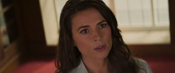 Movie still from “Mission: Impossible - Dead Reckoning Part One” (2023), directed by Christopher McQuarrie – A person with long brown hair; Close Up shot, Over the shoulder angle