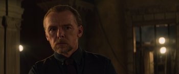 Movie still from “Mission: Impossible - Dead Reckoning Part One” (2023), directed by Christopher McQuarrie – A person wearing a suit and tie; Close Up shot, Over the shoulder angle