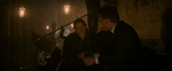 Movie still from “Mission: Impossible - Dead Reckoning Part One” (2023), directed by Christopher McQuarrie – A man and a woman in a suit and tie talking to each other; Medium shot, High angle