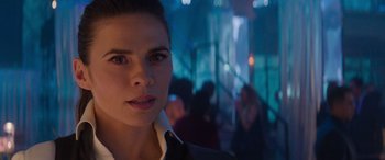 Movie still from “Mission: Impossible - Dead Reckoning Part One” (2023), directed by Christopher McQuarrie – A person wearing a suit and tie; Close Up shot, Over the shoulder angle