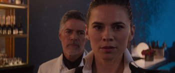 Movie still from “Mission: Impossible - Dead Reckoning Part One” (2023), directed by Christopher McQuarrie – A man and a woman standing next to each other in front of a wall; Close Up shot, Over the shoulder angle