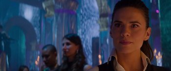 Movie still from “Mission: Impossible - Dead Reckoning Part One” (2023), directed by Christopher McQuarrie – A man and two other people in a dark room; Close Up shot, Over the shoulder angle