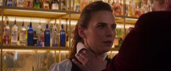 Movie still from “Mission: Impossible - Dead Reckoning Part One” (2023), directed by Christopher McQuarrie – A young woman with long brown hair wearing a white shirt; Close Up shot, Over the shoulder angle