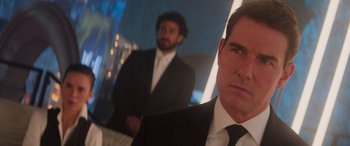 Movie still from “Mission: Impossible - Dead Reckoning Part One” (2023), directed by Christopher McQuarrie – A man in a suit and tie next to another man in a suit and tie; Close Up shot, Over the shoulder angle