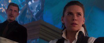 Movie still from “Mission: Impossible - Dead Reckoning Part One” (2023), directed by Christopher McQuarrie – A person wearing a suit and tie; Close Up shot, Over the shoulder angle