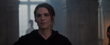 Movie still from “Mission: Impossible - Dead Reckoning Part One” (2023), directed by Christopher McQuarrie – A person wearing a black hoodie; Close Up shot, Over the shoulder angle