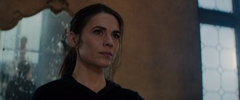 Movie still from “Mission: Impossible - Dead Reckoning Part One” (2023), directed by Christopher McQuarrie – A person wearing a black shirt; Close Up shot, Over the shoulder angle