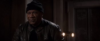 Movie still from “Mission: Impossible - Dead Reckoning Part One” (2023), directed by Christopher McQuarrie – A man wearing a leather jacket and a black hat; Close Up shot, High angle