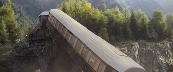 Movie still from “Mission: Impossible - Dead Reckoning Part One” (2023), directed by Christopher McQuarrie – An overhead view of a train on a bridge; Extreme Wide shot, High angle