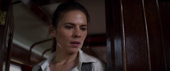 Movie still from “Mission: Impossible - Dead Reckoning Part One” (2023), directed by Christopher McQuarrie – A person wearing a shirt and tie; Close Up shot, Over the shoulder angle