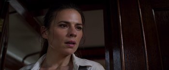 Movie still from “Mission: Impossible - Dead Reckoning Part One” (2023), directed by Christopher McQuarrie – A person wearing a white shirt; Close Up shot, Over the shoulder angle