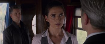 Movie still from “Mission: Impossible - Dead Reckoning Part One” (2023), directed by Christopher McQuarrie – A person wearing a shirt and tie; Close Up shot, Over the shoulder angle