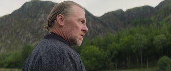 Movie still from “Mission: Impossible - Dead Reckoning Part One” (2023), directed by Christopher McQuarrie – A person wearing a jacket; Close Up shot, Over the shoulder angle