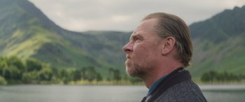 Movie still from “Mission: Impossible - Dead Reckoning Part One” (2023), directed by Christopher McQuarrie – A person looking at a body of water; Close Up shot, Over the shoulder angle