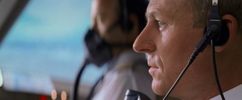 Movie still from “Mission: Impossible II” (2000), directed by John Woo – A person wearing a headset; Close Up shot, Low angle