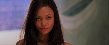 Movie still from “Mission: Impossible II” (2000), directed by John Woo – A person with long black hair; Close Up shot, Low angle