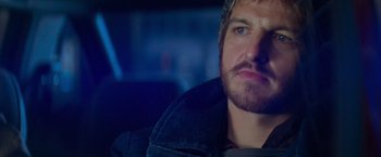 Movie still from “Mission: Impossible II” (2000), directed by John Woo – A person with a beard; Close Up shot, Over the shoulder angle