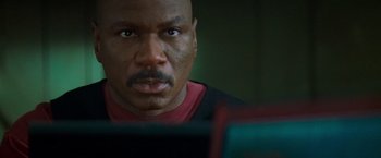 Movie still from “Mission: Impossible II” (2000), directed by John Woo – A person looking at a computer screen; Close Up shot, Low angle