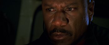 Movie still from “Mission: Impossible II” (2000), directed by John Woo – A man's eyes and face; Close Up shot, Low angle