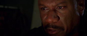 Movie still from “Mission: Impossible II” (2000), directed by John Woo – A man's eyes and face; Extreme Close Up shot, High angle