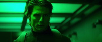 Movie still from “Mission: Impossible II” (2000), directed by John Woo – A person in a green room; Close Up shot, Low angle