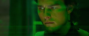 Movie still from “Mission: Impossible II” (2000), directed by John Woo – A person with a green background; Close Up shot, Low angle