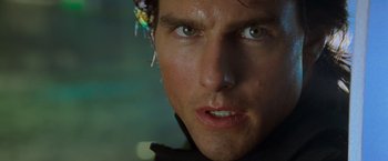 Movie still from “Mission: Impossible II” (2000), directed by John Woo – A person wearing a jacket; Close Up shot, Over the shoulder angle