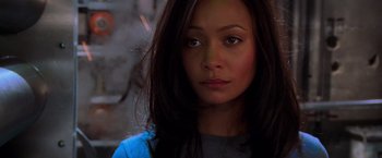 Movie still from “Mission: Impossible II” (2000), directed by John Woo – A person with long black hair; Close Up shot, High angle