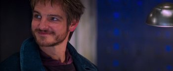 Movie still from “Mission: Impossible II” (2000), directed by John Woo – A man's face with blue eyes; Close Up shot, Over the shoulder angle