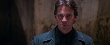 Movie still from “Mission: Impossible II” (2000), directed by John Woo – A person wearing a jacket; Close Up shot, Low angle