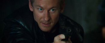 Movie still from “Mission: Impossible II” (2000), directed by John Woo – A person holding a bird; Close Up shot, High angle