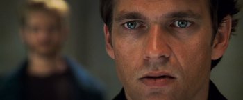 Movie still from “Mission: Impossible II” (2000), directed by John Woo – A man's blue eyes; Close Up shot, Over the shoulder angle