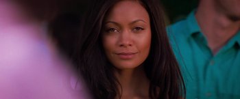 Movie still from “Mission: Impossible II” (2000), directed by John Woo – A person with long black hair; Close Up shot, Over the shoulder angle