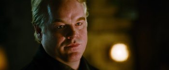 Movie still from “Mission: Impossible III” (2006), directed by J.J. Abrams – A person wearing a black shirt; Close Up shot, Over the shoulder angle