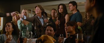 Movie still from “Mission: Impossible III” (2006), directed by J.J. Abrams – A group of people standing in a room with wine glasses; Medium shot, Over the shoulder angle