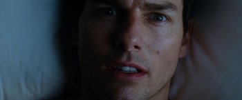 Movie still from “Mission: Impossible III” (2006), directed by J.J. Abrams – A man's face in the dark; Close Up shot, Low angle