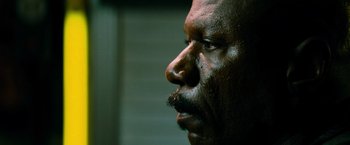 Movie still from “Mission: Impossible III” (2006), directed by J.J. Abrams – A man's face with dirt all over his face; Extreme Close Up shot, Low angle