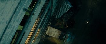 Movie still from “Mission: Impossible III” (2006), directed by J.J. Abrams – An overhead view of a car parked in a parking lot; Extreme Wide shot, Overhead angle
